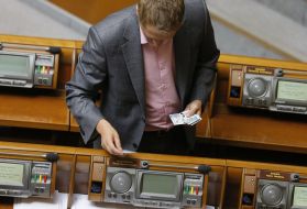 People's deputy holds cards for voting