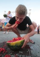 A boy eating watermelon