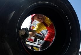 An employee changes the tire wheel