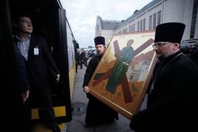 Priests carry icon