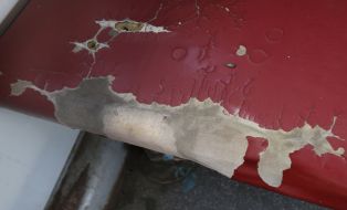 Torn upholstering of seat