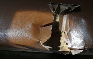 Torn upholstering of seat