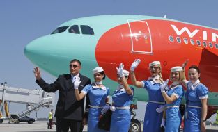 Andrey Golukh with a team of flight attendants