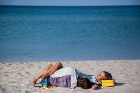 Young people rest on a beach