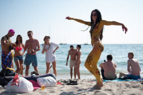 The girl dances on a beach