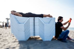 The girl sleeps on a beach