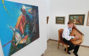 A musician plays on a bandura 