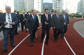 Aleksandr Popov examines the football field