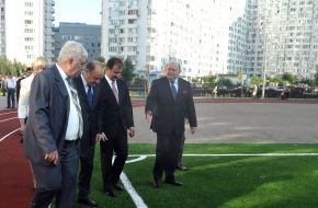 Aleksandr Popov examines the football field