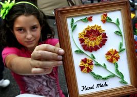 A girl holds a picture