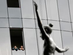 Men look out of the window