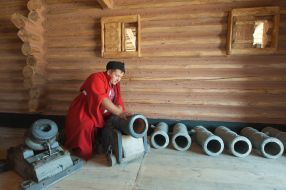 A man dressed as a Cossack gun shows