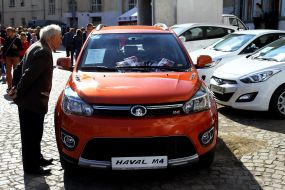 An old man sees a car