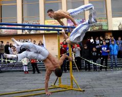 Men doing exercises on the horizontal bar