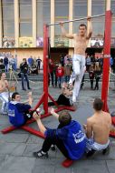 Men doing exercises on the horizontal bar