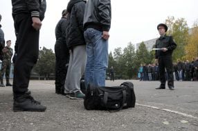 The officer talks to recruits