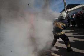 Employee GUCHS extinguishes a burning effigy