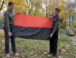 The participants of action hold a flag