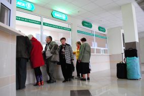 People stand in a queue