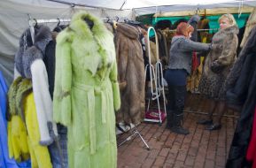 Women trying on fur products