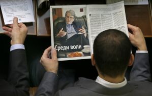 Deputy reading a newspaper