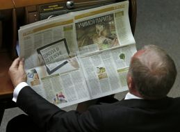 Deputy reading a newspaper