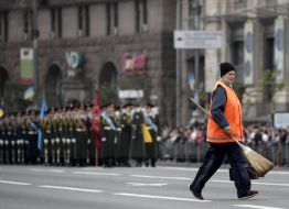 The cleaning lady crossing the road