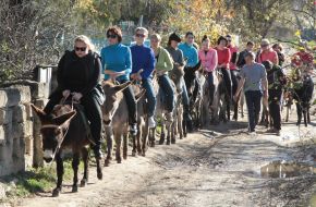 People ride on donkeys