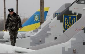 The technician in the cockpit of the MiG-29