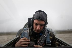 The technician in the cockpit of the MiG-29