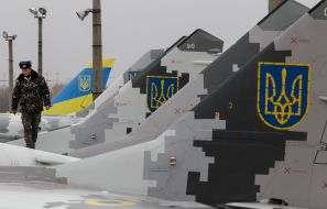 The technician in the cockpit of the MiG-29