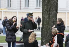 The soldier eats a sandwich