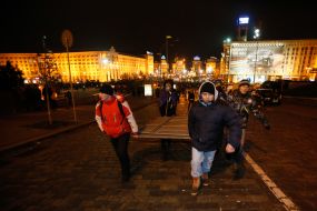 Participants of the rally fencing metallic shields Independence Square