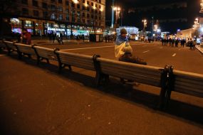 Participants of the action set benches on the roadway