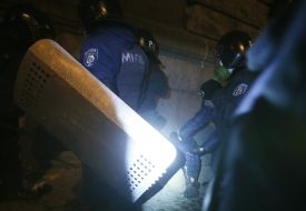 Policemen beat Photographer