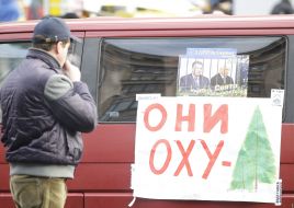 A man examines a placard