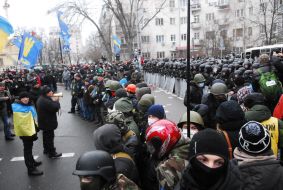 Participants of the mass meeting near the cordon of militia 