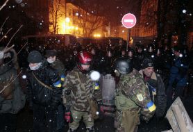 Participants of the mass meeting near the cordon of militia