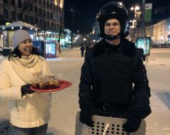 Girl gives tea to soldiers of internal troops
