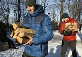 Men carry firewood