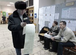 A man examines a list of candidates