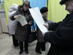 A man examines a list of candidates