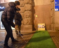 Young people play golf