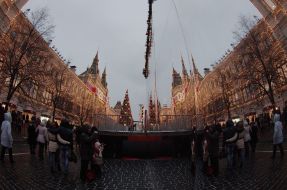 People photographed near mirror wall