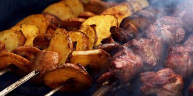 Potatoes and kebab on skewers