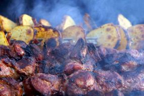 Potatoes and kebab on skewers