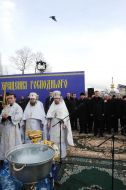 Priests lead consecrated water