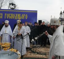 Priests lead consecrated water