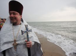 A priest conducts the rite of consecration of water