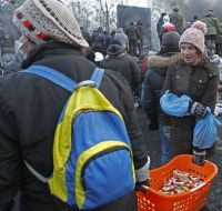 Girls give the protesters sandwiches